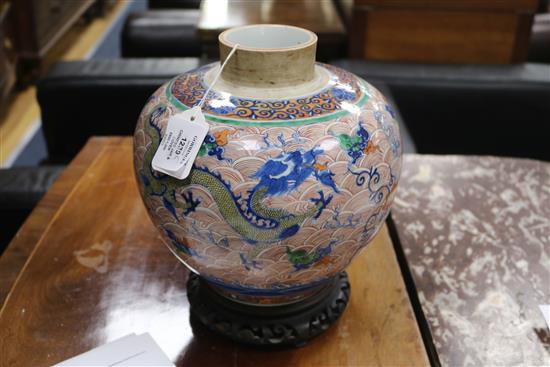 A Chinese doucai dragon ovoid jar and cover, Yongzheng four character mark but 19th century, height 24.5cm excl. wood stand